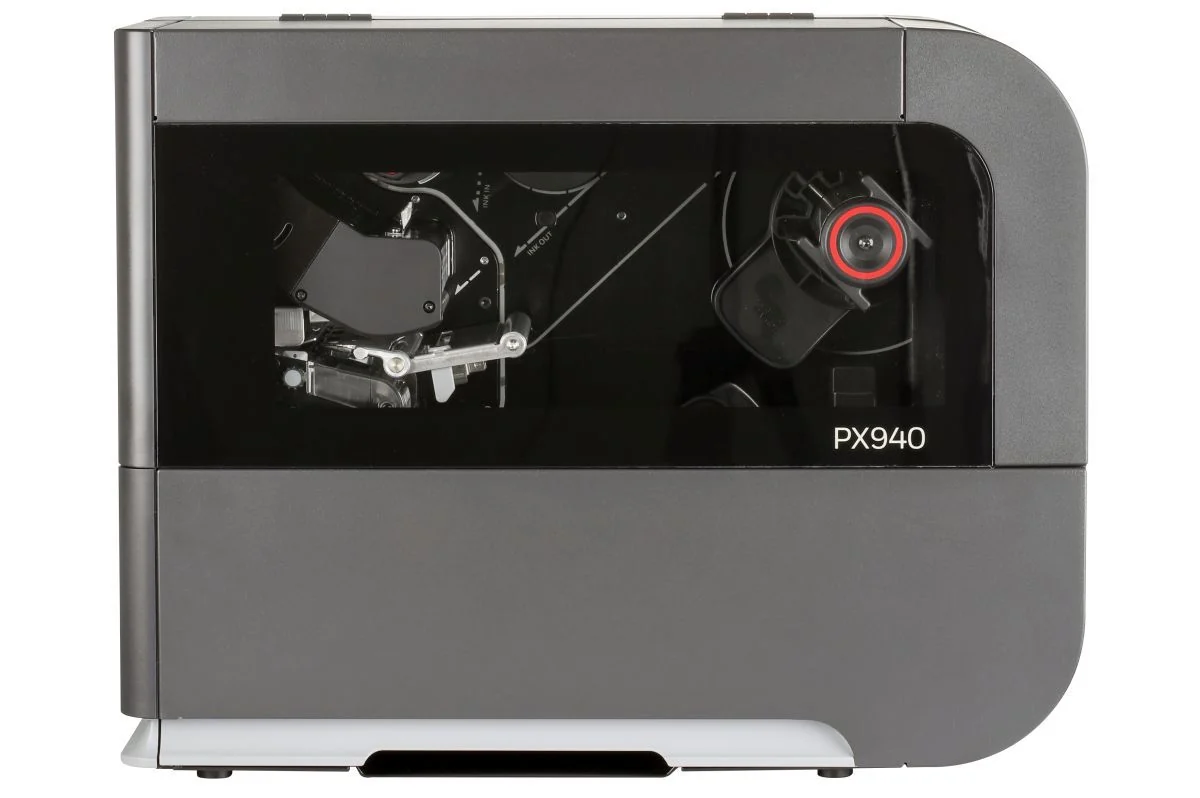 Side view of the Honeywell PX940 showing label media and the print mechanism through its cover